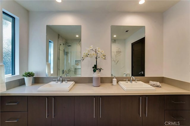 bathroom featuring vanity and an enclosed shower