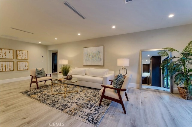 living room with light hardwood / wood-style floors