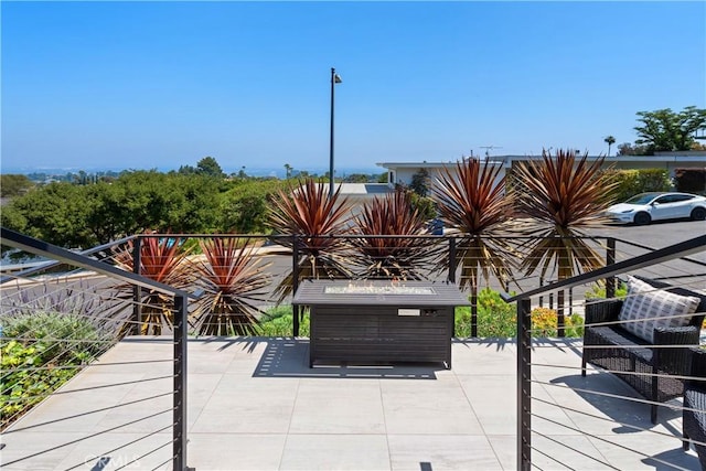 wooden terrace featuring a patio