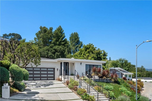 view of front of property with a garage