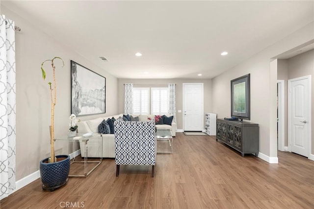 living room with light hardwood / wood-style floors