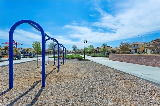 view of property's community with a playground