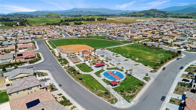 birds eye view of property with a mountain view