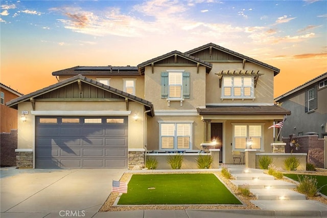 craftsman house featuring a porch and a garage