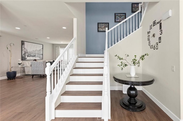 stairway featuring hardwood / wood-style flooring