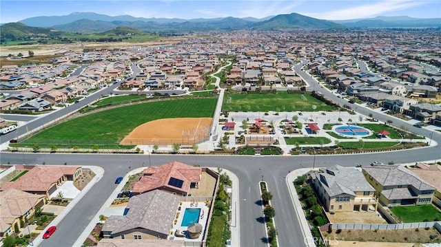 birds eye view of property with a mountain view