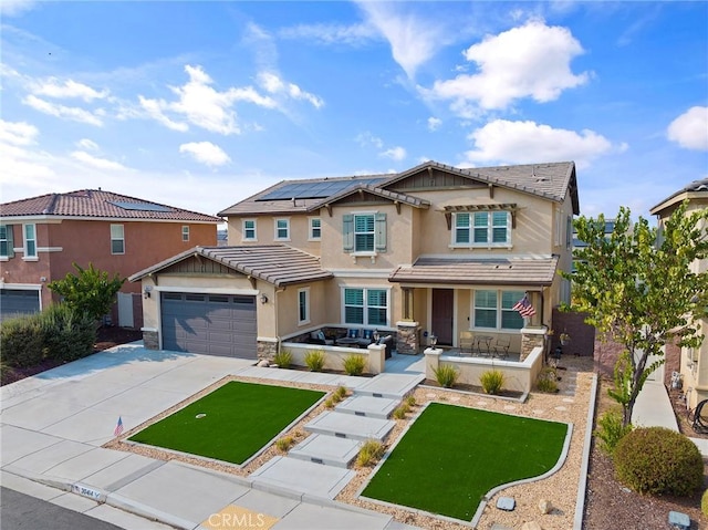 craftsman inspired home with a garage, solar panels, and covered porch