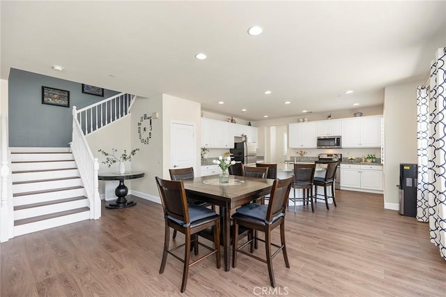 dining room with light wood-type flooring