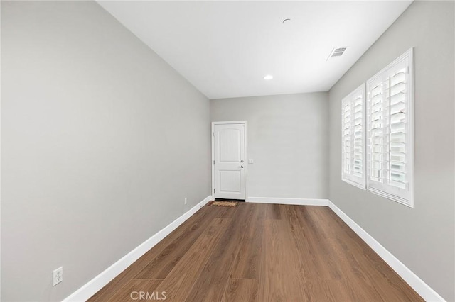 empty room featuring wood-type flooring