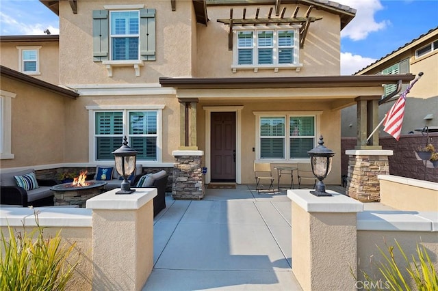 doorway to property featuring a patio