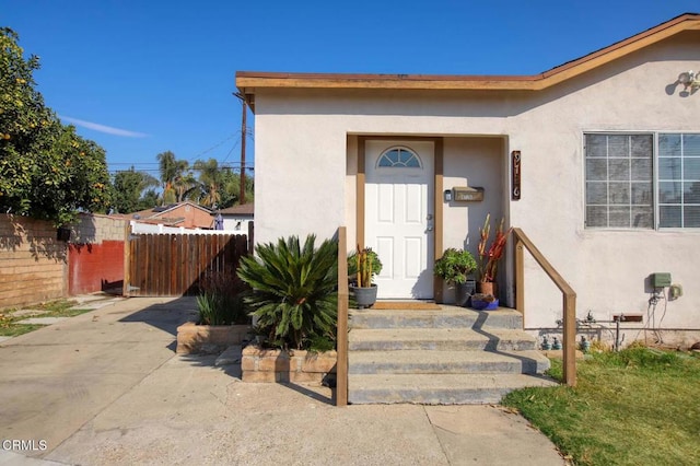 doorway to property with a patio area