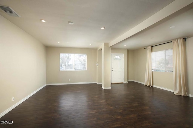 unfurnished living room with dark hardwood / wood-style floors