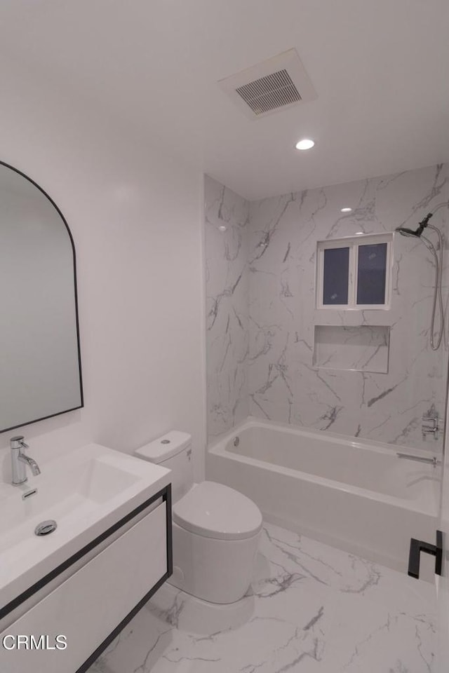 full bathroom with visible vents, bathing tub / shower combination, toilet, marble finish floor, and vanity