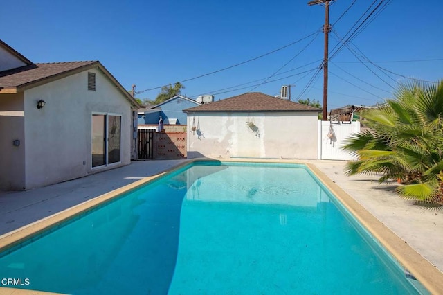 view of pool featuring a fenced in pool, a patio area, and fence