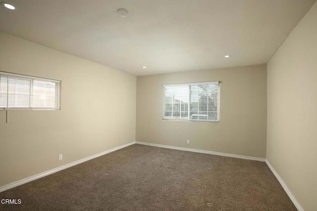 carpeted empty room with recessed lighting and baseboards