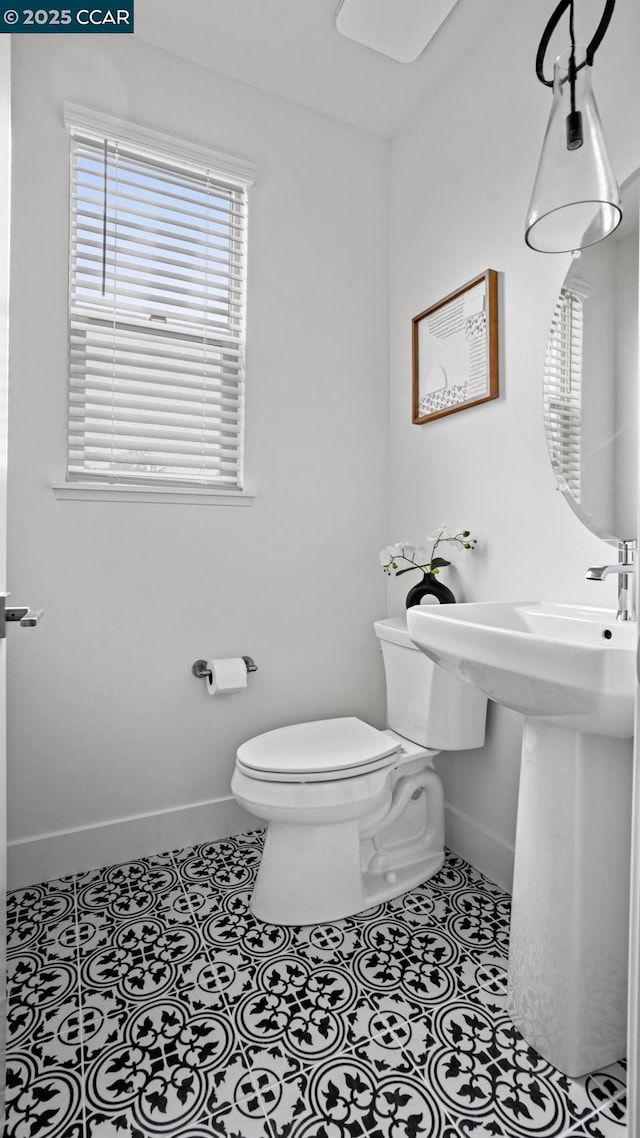 bathroom with tile patterned flooring and toilet