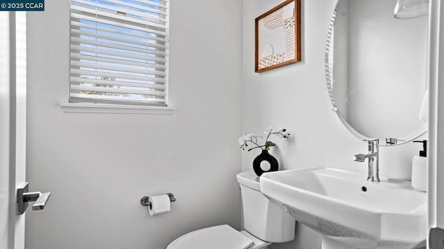 bathroom featuring sink and toilet