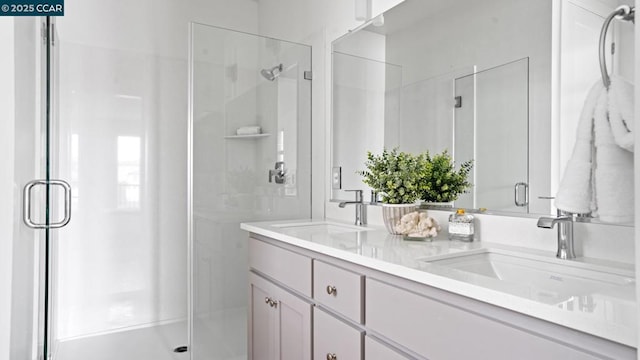 bathroom with vanity and an enclosed shower