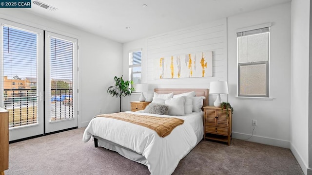 bedroom featuring carpet flooring and access to outside