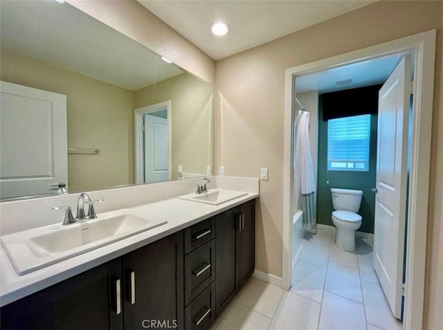 full bathroom featuring vanity, tile patterned floors, toilet, and shower / tub combo with curtain