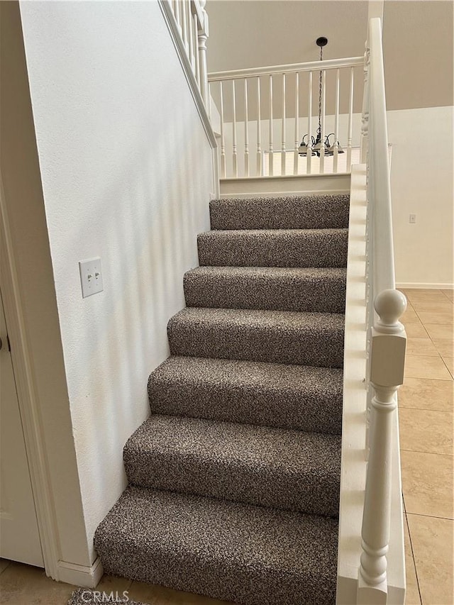 staircase with tile patterned flooring