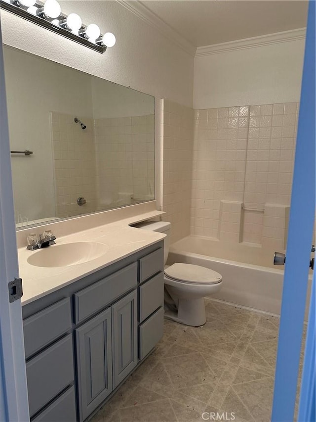 full bathroom featuring vanity, ornamental molding, toilet, and washtub / shower combination