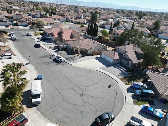 birds eye view of property with a mountain view