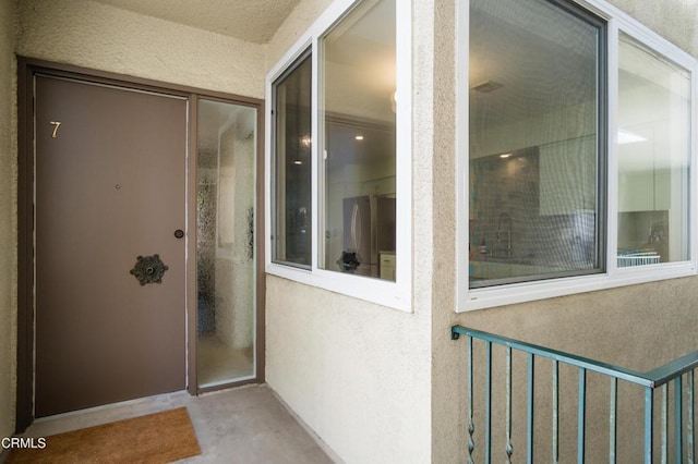 doorway to property with a balcony