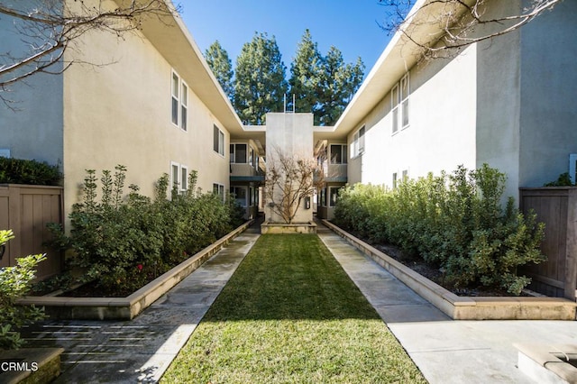 view of property's community with a lawn