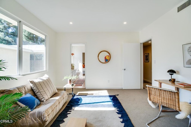 living room with light colored carpet