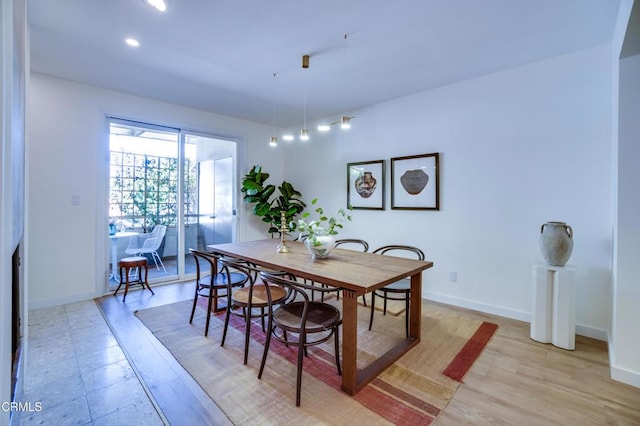 dining room with light hardwood / wood-style floors