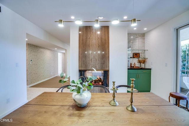 dining space with a multi sided fireplace