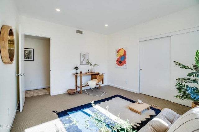 interior space with carpet flooring and a closet