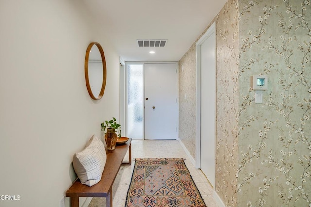 entryway with light tile patterned floors