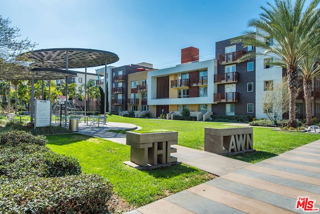 view of community featuring a lawn