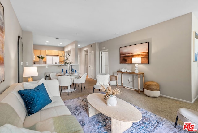 living room featuring light colored carpet