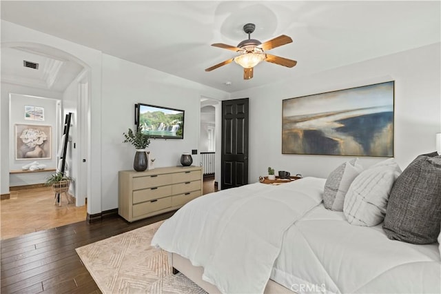 bedroom with dark wood-type flooring and ceiling fan