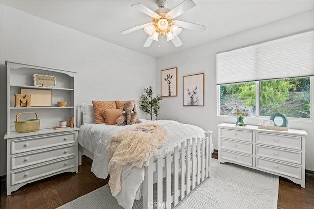 bedroom with ceiling fan and light wood-type flooring