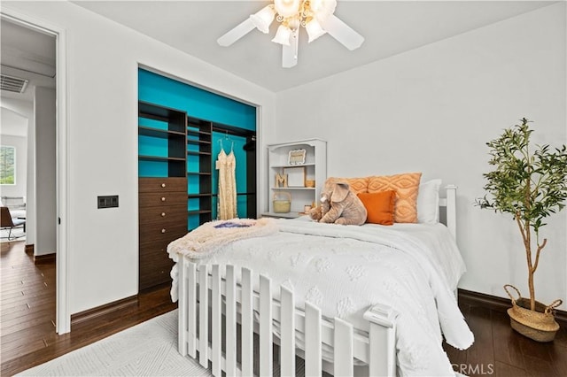 bedroom featuring hardwood / wood-style flooring and ceiling fan