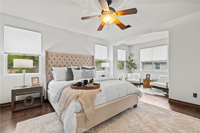 bedroom with wood-type flooring and ceiling fan