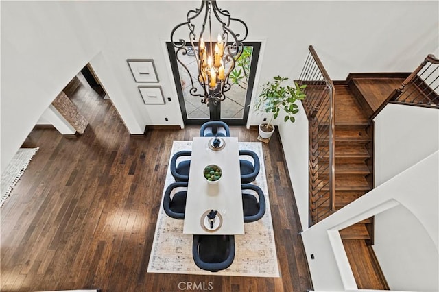 details with wood-type flooring and a notable chandelier