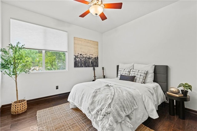 bedroom with wood-type flooring and ceiling fan