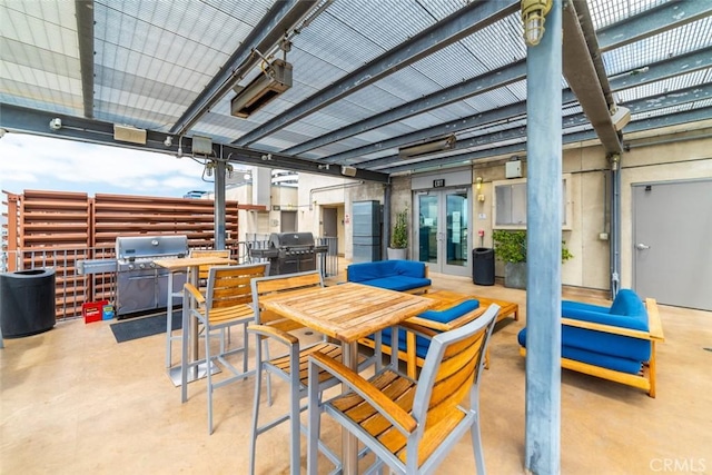 view of patio featuring area for grilling and a pergola