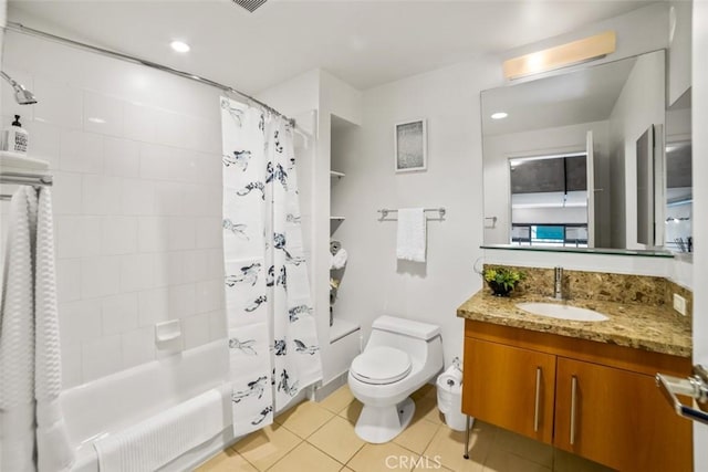 full bathroom with shower / tub combo with curtain, vanity, tile patterned flooring, and toilet