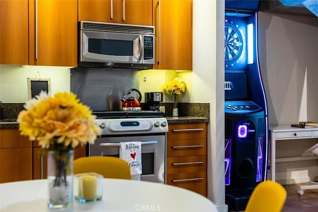 kitchen featuring stainless steel appliances and backsplash