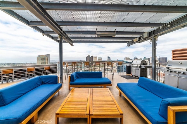 view of patio with outdoor lounge area and grilling area