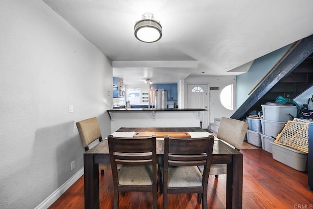 dining area featuring dark hardwood / wood-style floors