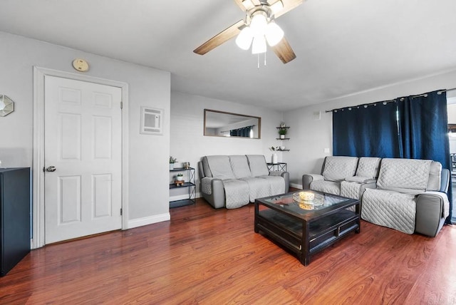 living room with hardwood / wood-style flooring and ceiling fan