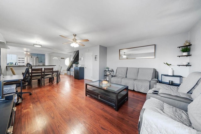 living room featuring dark hardwood / wood-style floors and ceiling fan