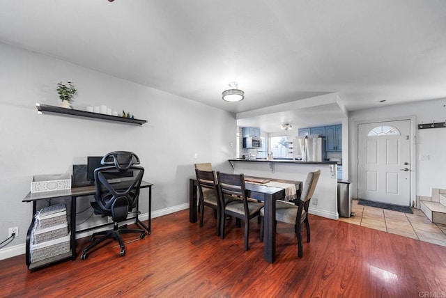 dining area with hardwood / wood-style floors